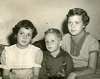 This is a picture of me with my siblings as children. I am on the left with younger brother Bob in the middle and my older sister Marti on the right